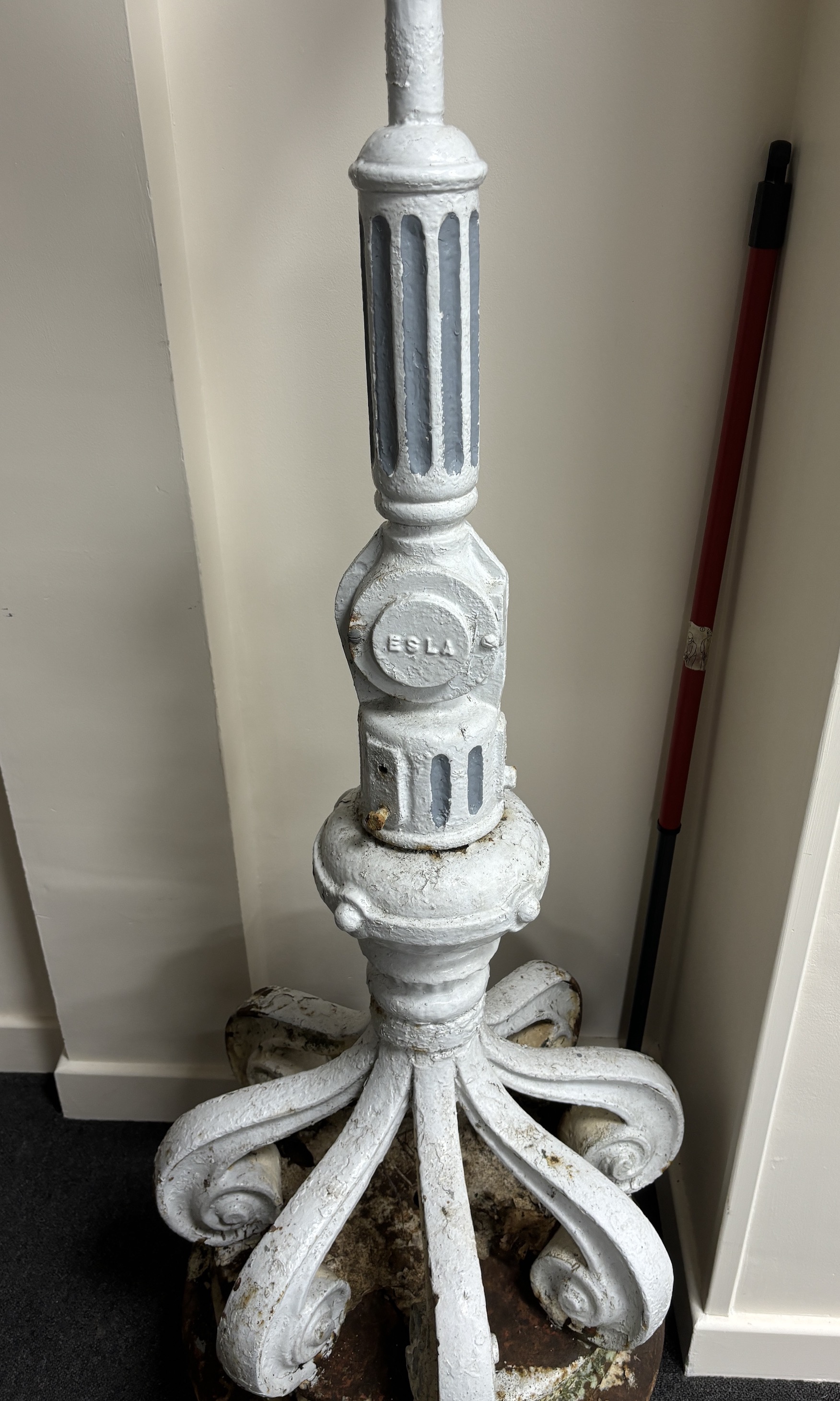 A late 19th/early 20th century cast iron promenade lamp, height 224cm.